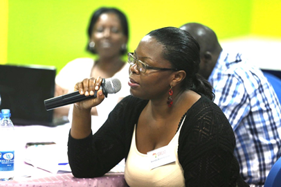 woman uses microphone to speak