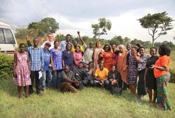 group of happy university students pose for a photo