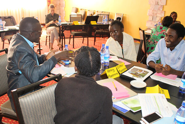 participants sit around a table for training