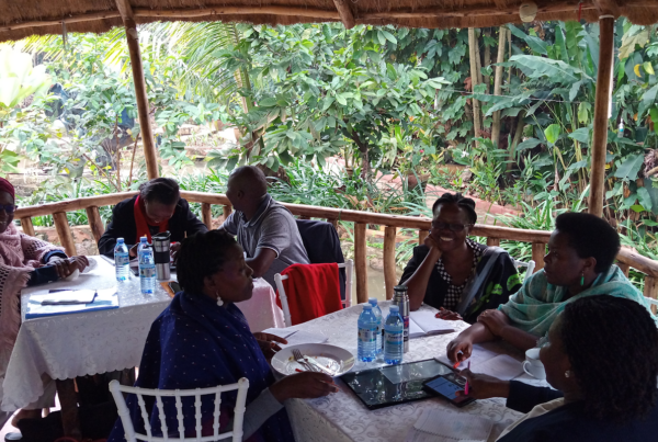 particpants have a discussion around a table