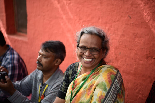 A smiling woman outside