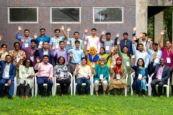 The participants wave outside