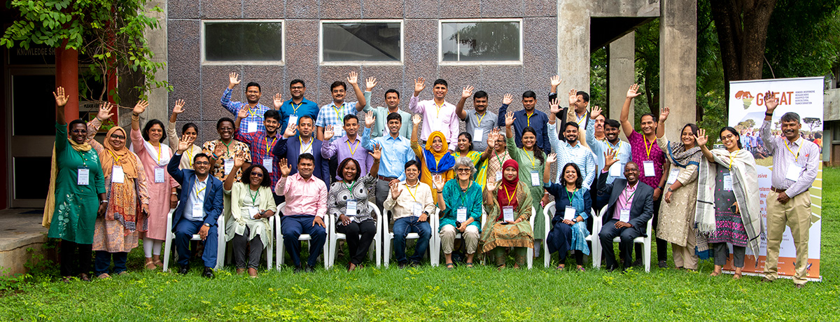 The participants wave outside